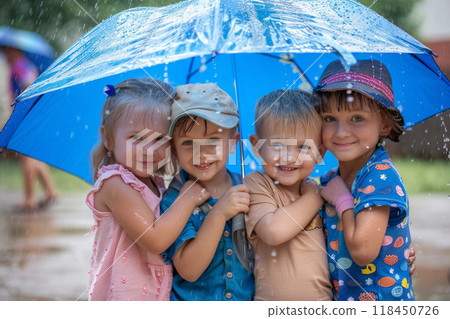 Joyful Children Huddling Under a Blue Umbrella 118450726
