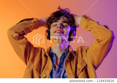 Joyful Young Person Vibing to Music on Headphones 118450816
