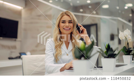 Smiling Businesswoman on Phone in Modern Office 118450832