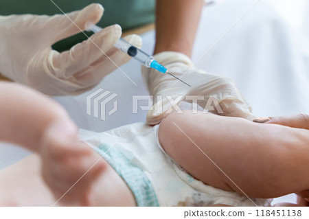 Nurse vaccinates newborn at hospital providing protection against diseases Nurse vaccinates newborn at hospital providing protection against diseases 118451138