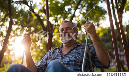 Joyful Senior Man on Swing at Sunset 118451185