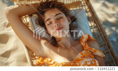 Woman Relaxing on a Beach Hammock 118451221