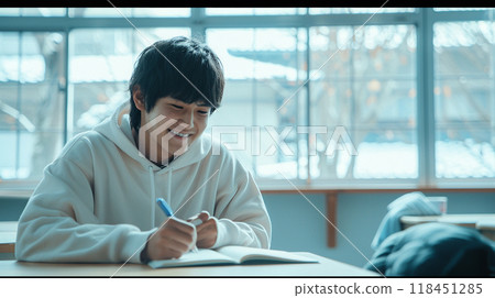 Student Studying in Sunlit Classroom Student Studying in Sunlit Classroom 118451285