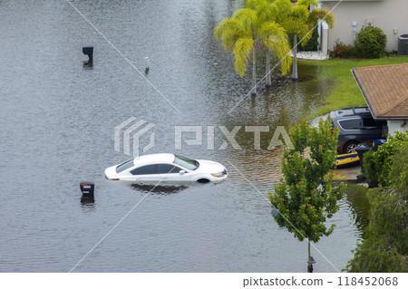 Flooded car and house from hurricane Debby rainfall water in Laurel Meadows community in Sarasota, Florida. Aftermath of natural disaster in USA south Flooded car and house from hurricane Debby rainfall water in Laurel Meadows community in Sarasota, Florida. Aftermath of natural disaster in USA south 118452068