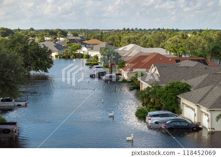 Flooded cars and houses from hurricane Debby rainfall water in Laurel Meadows community in Sarasota, Florida. Aftermath of natural disaster in USA south Flooded cars and houses from hurricane Debby rainfall water in Laurel Meadows community in Sarasota, Florida. Aftermath of natural disaster in USA south 118452069