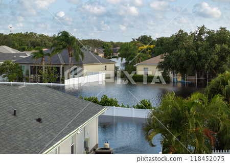 Flooded houses from hurricane Debby rainfall water in Laurel Meadows community in Sarasota, Florida. Aftermath of natural disaster in USA south Flooded houses from hurricane Debby rainfall water in Laurel Meadows community in Sarasota, Florida. Aftermath of natural disaster in USA south 118452075