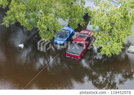 Flooded residential area with underwater cars and houses from hurricane Debby rainfall water in residential community in Sarasota, Florida. Aftermath of natural disaster in southern USA 118452078