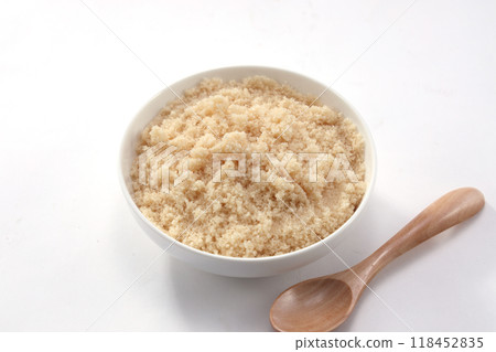 Brown sugar in a white dish 118452835