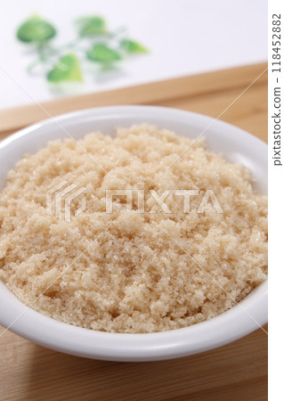 Brown sugar served on a white plate Brown sugar served on a white plate 118452882