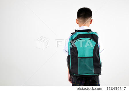 Back view Asian little boy primary posing with black and green backpack studio isolated white background, happy cute man kid wear school uniform and schoolbag, back to school concept Back view Asian little boy primary posing with black and green backpack studio isolated white background, happy cute man kid wear school uniform and schoolbag, back to school concept 118454847