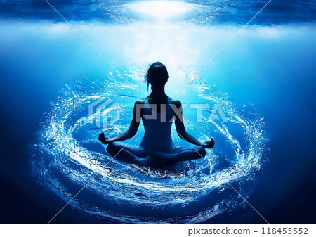 Silhouette of a woman meditating underwater 118455552