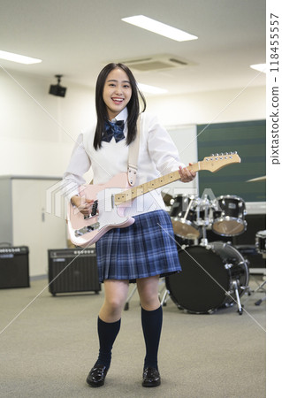 High school girl playing electric guitar Photography cooperation: Ariake College of Education and Arts High school girl playing electric guitar Photography cooperation: Ariake College of Education and Arts 118455557