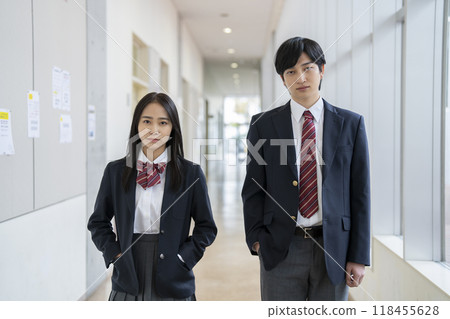 Two high school students, a boy and a girl, looking at the camera Two high school students, a boy and a girl, looking at the camera 118455628