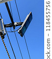 Traffic light that shines in the blue sky 118455756