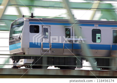 Keihin Tohoku Line E233 train crossing the Arakawa bridge Keihin Tohoku Line E233 train crossing the Arakawa bridge 118456174