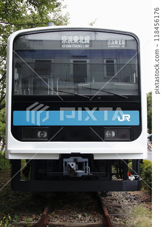 A prototype 209 series car stored in front of the main gate of the Tokyo General Rolling Stock Center. A prototype 209 series car stored in front of the main gate of the Tokyo General Rolling Stock Center. 118456176