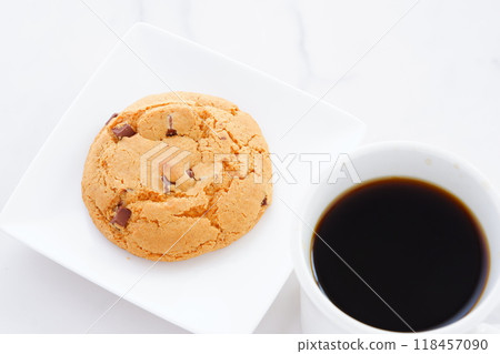 Enjoy a coffee break with chocolate chip cookies and freshly brewed coffee. 118457090