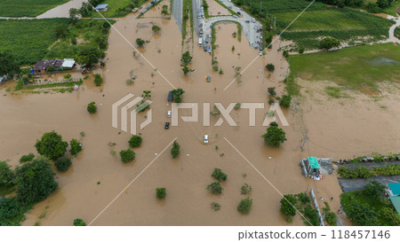 Aerial view of Chiang Rai downtown flooding by Kok river after heavy rain. This river is the blood line for people of Chiang Rai, started from the hills on boarder of Myanmar. Aerial view of Chiang Rai downtown flooding by Kok river after heavy rain. This river is the blood line for people of Chiang Rai, started from the hills on boarder of Myanmar. 118457146
