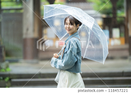A woman with an umbrella, a woman traveling near Kamakura, a woman traveling during the rainy season 118457221