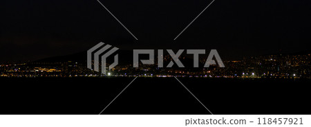 The skyline of Istanbul comes alive at night, showcasing vibrant lights reflecting on the water, creating a captivating urban landscape. 118457921