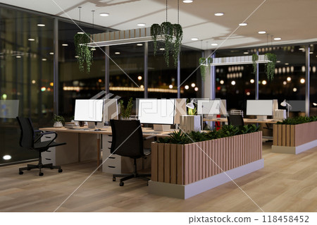 The interior design of a contemporary office in a skyscraper at night features computer desks. The interior design of a contemporary office in a skyscraper at night features computer desks. 118458452