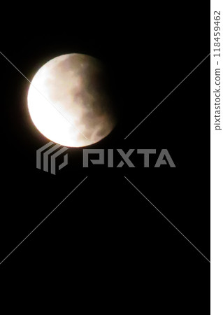 Partial Lunar Eclipse Night Sky.A dramatic night sky photo taken during a partial lunar eclipse. Partial Lunar Eclipse Night Sky.A dramatic night sky photo taken during a partial lunar eclipse. 118459462