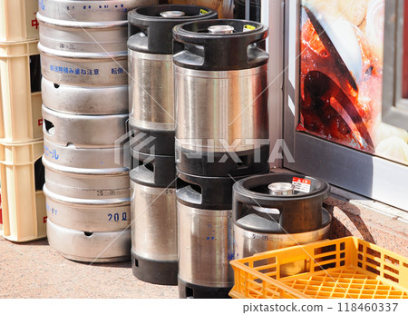 Draft beer barrels stacked outside a restaurant 118460337
