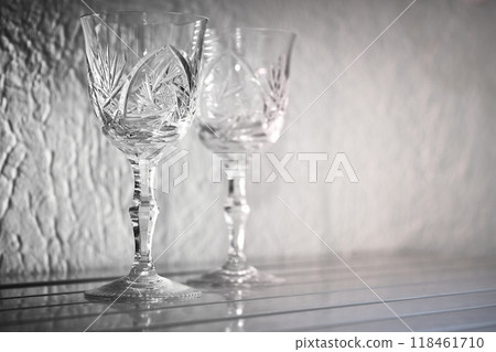 Drinking old wine.Two shining crystal wine glasses Drinking old wine.Two shining crystal wine glasses 118461710