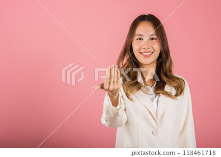 Happy Asian portrait beautiful cute young woman teen smile positive friendly making gesture hand inviting to come here with hand look to camera studio shot isolated on pink background with copy space Happy Asian portrait beautiful cute young woman teen smile positive friendly making gesture hand inviting to come here with hand look to camera studio shot isolated on pink background with copy space 118461718