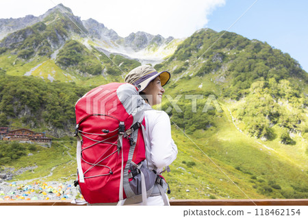 Woman climbing the Japanese Alps Woman climbing the Japanese Alps 118462154