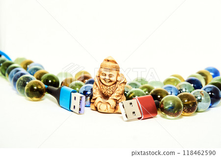 Red and blue usb cables and Buddha figurine. Connect and chat 118462590