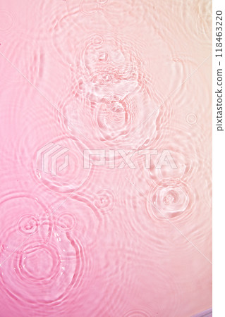 A delicate photo of pink water with concentric circles outwards from the center. The soft pink and gentle ripples create a sense of tranquility, perfect for promoting products related to relaxation. A delicate photo of pink water with concentric circles outwards from the center. The soft pink and gentle ripples create a sense of tranquility, perfect for promoting products related to relaxation. 118463220