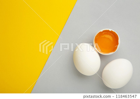 Easter decoration white eggs on colored background. Easter concept. Easter decoration white eggs on colored background. Easter concept. 118463547