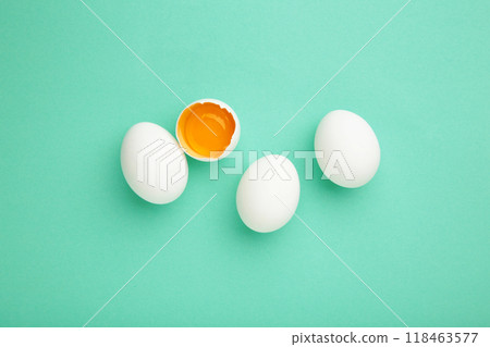 Easter decoration white eggs on mint background, minimal design with space for text Easter decoration white eggs on mint background, minimal design with space for text 118463577