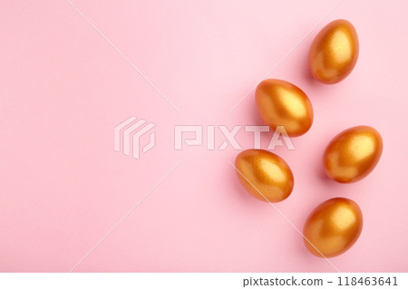 Gold eggs on the pink pastel background. Easter concept. 118463641