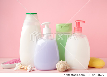 Collection of various beauty hygiene containers on pink background. Shower gel 118463677