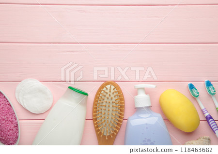 Bath products on pink background with copy space. Shower gel with aromatic salt, soap and other toiletry. 118463682