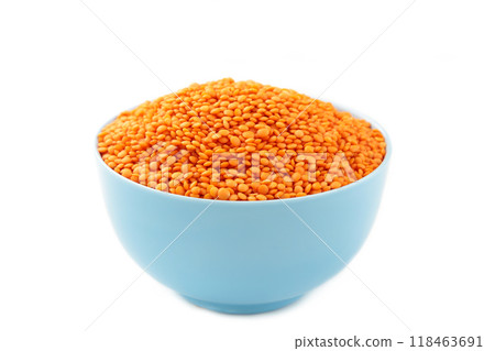 Red lentils in bowl isolated on a white background. Red lentils in bowl isolated on a white background. 118463691
