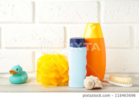 Toiletries baby on light background. Baby shower gel Toiletries baby on light background. Baby shower gel 118463696