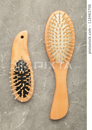 Set of comb and hairbrush on grey background. 118463706