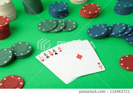Poker chips on a poker table at the casino. Poker on green background 118463721
