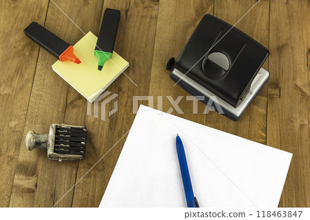 On the table are various office supplies. A variety of stationery are on the table 118463847