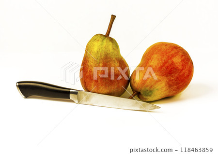 Two large ripe pears and a knife on a white background. On a white background two large ripe pears and a knife 118463859