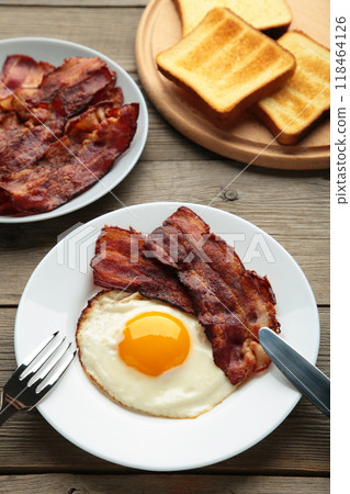 Eggs and bacon for breakfast on grey background. English breakfast. 118464126