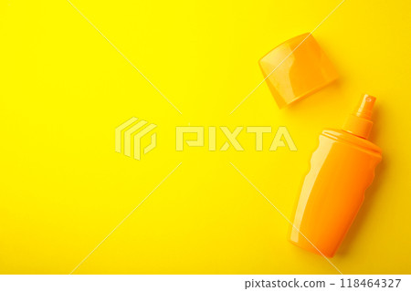 Sun protection bottle on yellow background. Summer vacation 118464327