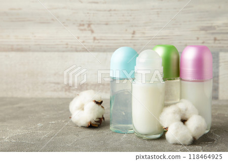 Different deodorants with cotton on light background with copy space. Different deodorants with cotton on light background with copy space. 118464925