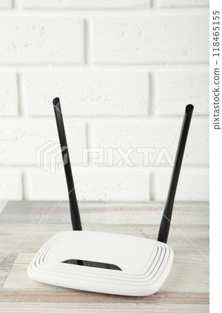 Wireless Wi-Fi router on a white background. Vertical photo Wireless Wi-Fi router on a white background. Vertical photo 118465155