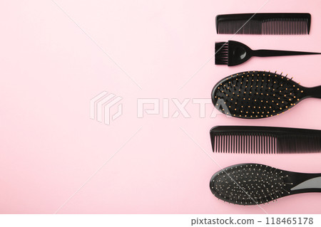 Hair tools, beauty and hairdressing concept - different brushes or combs on pink background with copy space Hair tools, beauty and hairdressing concept - different brushes or combs on pink background with copy space 118465178