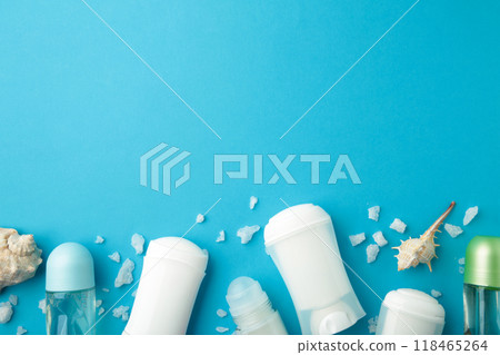 Deodorants for women and seashells on blue background with copy space 118465264