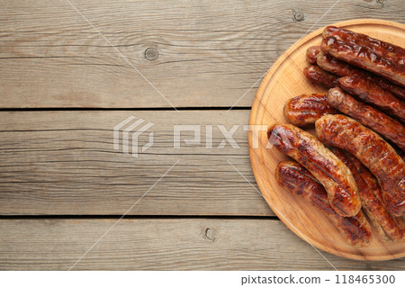 Grilled sausages on plate on grey wooden background with copy space Grilled sausages on plate on grey wooden background with copy space 118465300